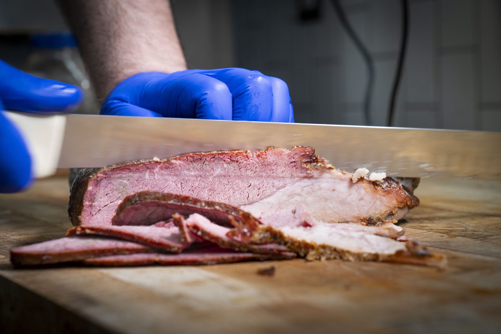 Hand-sliced beef brisket smoked over pecan wood at Southern Luv BBQ Tampa