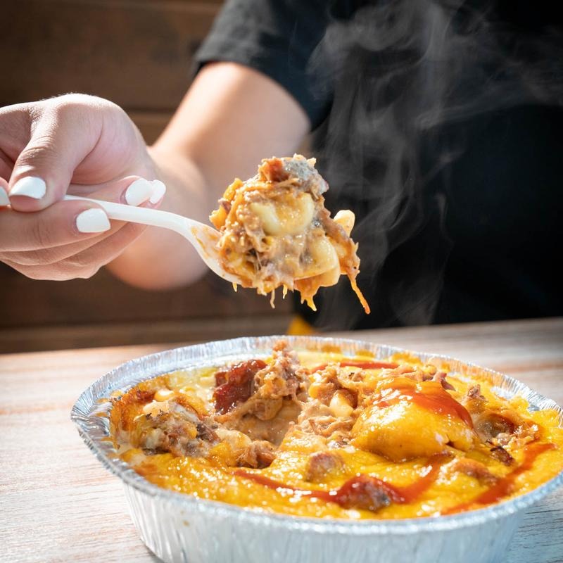 Smoked brisket mac and cheese with steam rising at Southern Luv BBQ