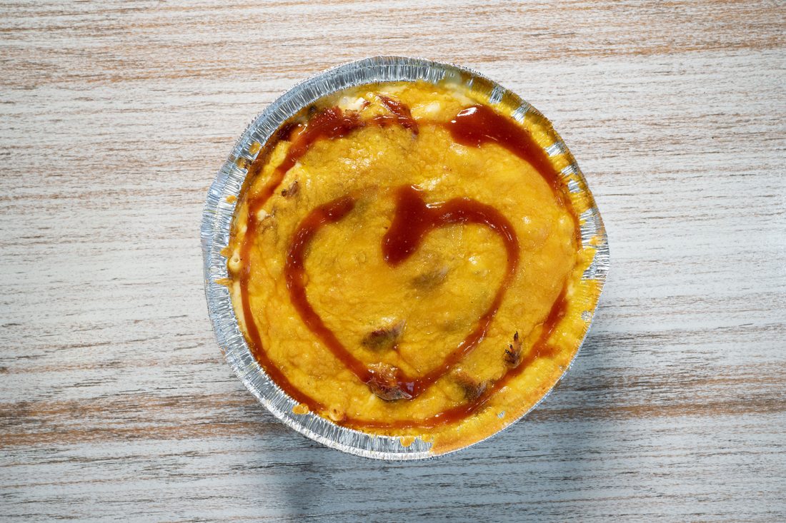 Smoked Brisket Mac & Cheese — Five-cheese mac topped with chopped brisket and a touch of BBQ sauce. The fan favorite.
