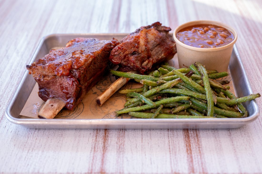 St. Louis Ribs — Smoked low and slow with our house rub. Half rack or full. Brushed with Carolina glaze just before serving.